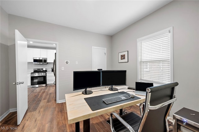 home office with dark wood-style floors and baseboards