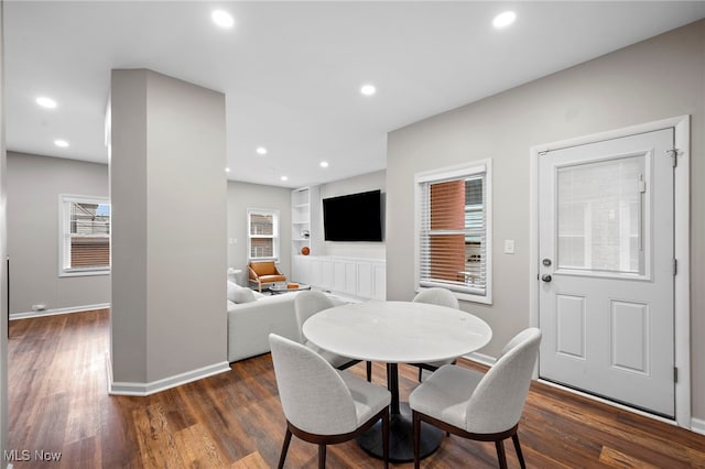 dining area featuring baseboards, dark wood-style flooring, and recessed lighting