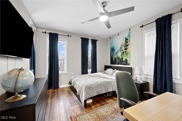 bedroom with wood finished floors and a ceiling fan