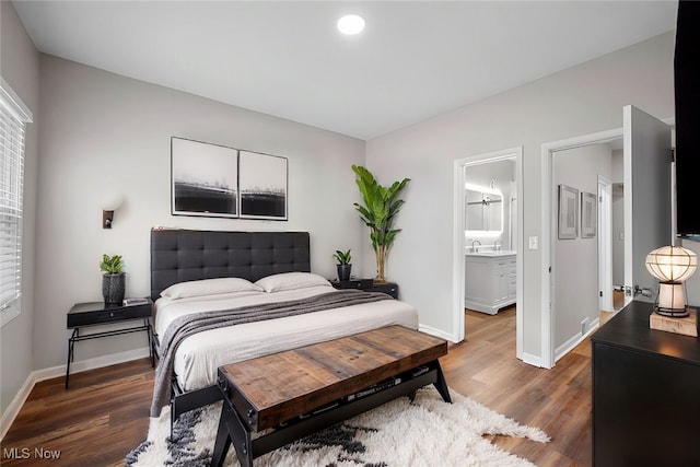 bedroom with dark wood-type flooring, recessed lighting, and baseboards