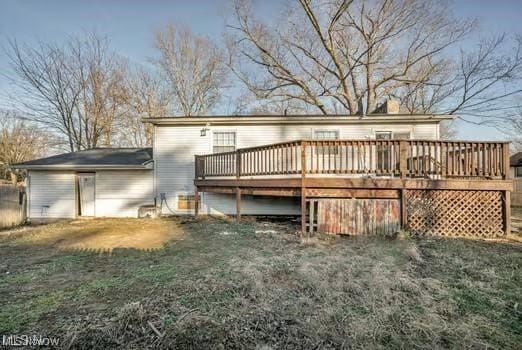 rear view of house with a wooden deck