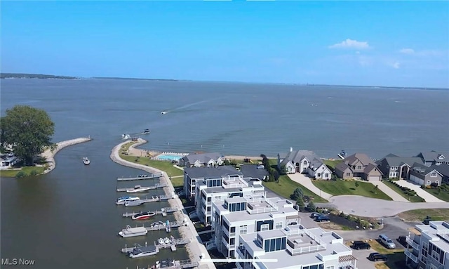 birds eye view of property with a residential view and a water view