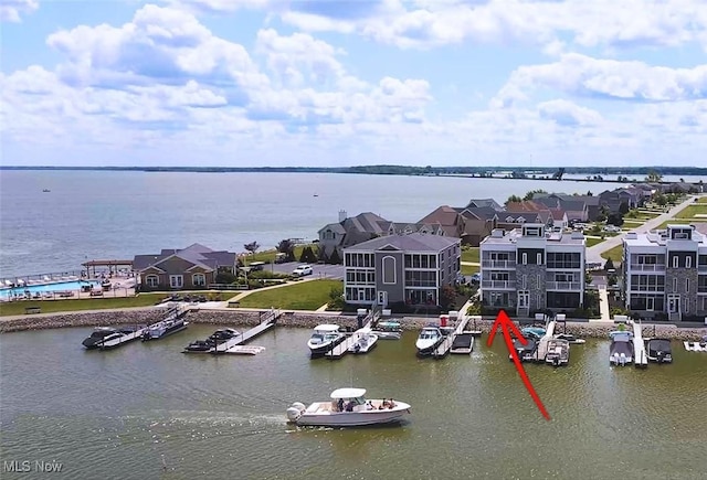 birds eye view of property featuring a water view