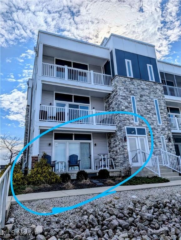 2568 S Waterside Ct Unit 211, Lakeside-Marblehead, OH 43440 - rear view of property with a balcony and stone siding