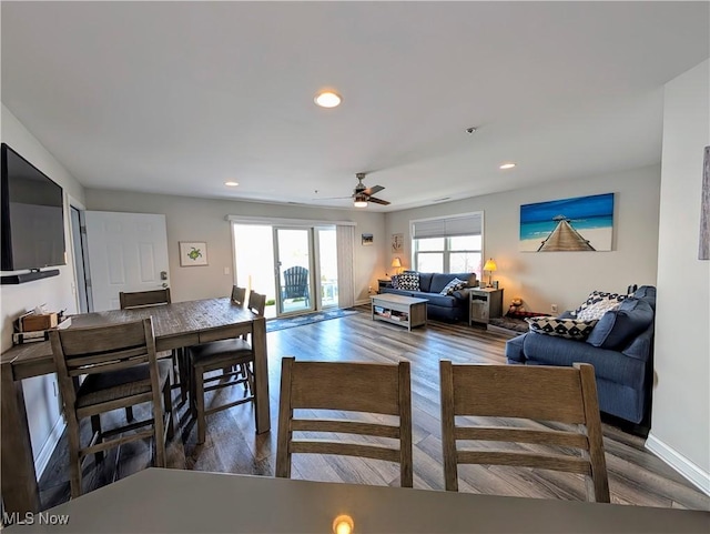 living area with recessed lighting, ceiling fan, baseboards, and wood finished floors