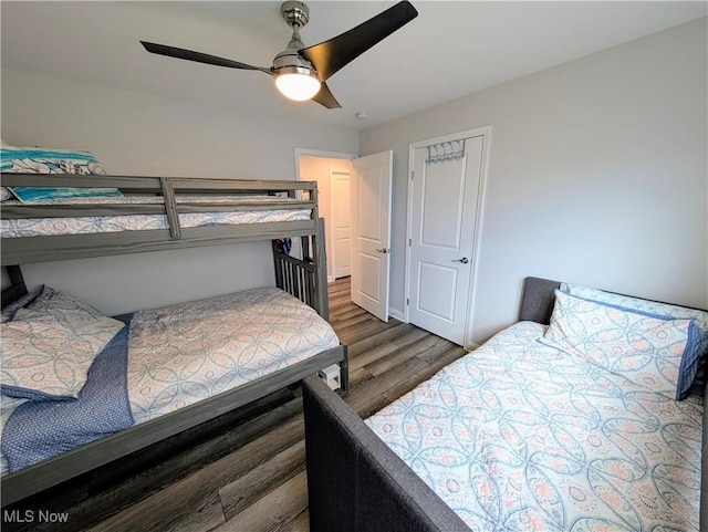 bedroom with a ceiling fan and wood finished floors