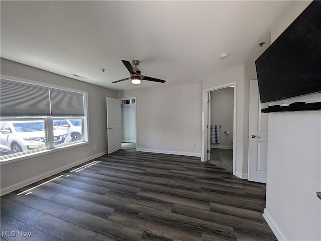 2568 S Waterside Ct Unit 211, Lakeside-Marblehead, OH 43440 - unfurnished bedroom featuring dark wood-type flooring, baseboards, a ceiling fan, and ensuite bath