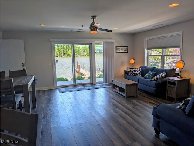 2568 S Waterside Ct Unit 211, Lakeside-Marblehead, OH 43440 - living area with a ceiling fan, dark wood-type flooring, baseboards, recessed lighting, and a water view