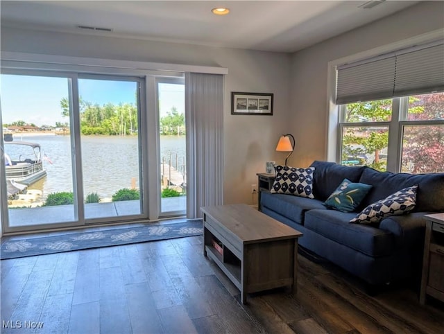 2568 S Waterside Ct Unit 211, Lakeside-Marblehead, OH 43440 - living room with a water view, dark wood finished floors, and recessed lighting