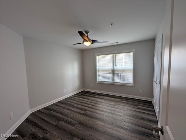 2568 S Waterside Ct Unit 211, Lakeside-Marblehead, OH 43440 - unfurnished room with dark wood-style flooring, a ceiling fan, baseboards, and fire sprinkler in ceiling