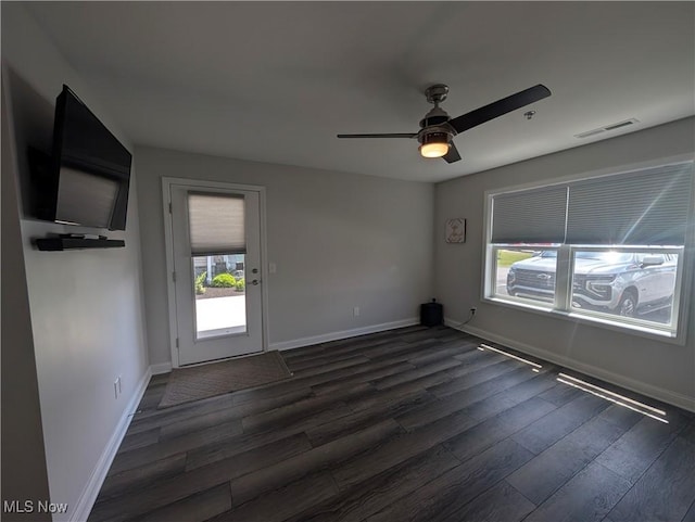 2568 S Waterside Ct Unit 211, Lakeside-Marblehead, OH 43440 - unfurnished room with dark wood-type flooring, baseboards, and a ceiling fan