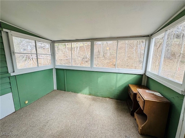 sunroom / solarium with plenty of natural light and vaulted ceiling