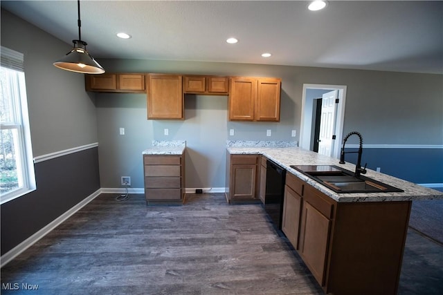 kitchen with a wealth of natural light, a sink, a peninsula, and dishwasher