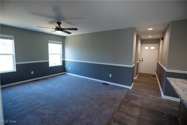 empty room featuring a ceiling fan, recessed lighting, visible vents, and baseboards