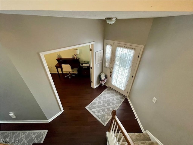 entrance foyer with wood finished floors and baseboards