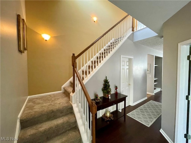 stairway featuring baseboards