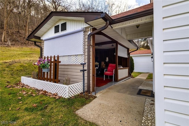 view of side of home featuring a lawn