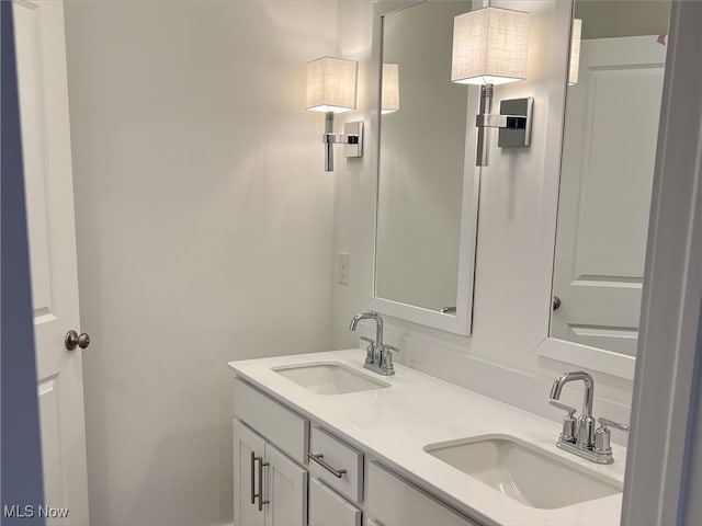 bathroom featuring double vanity and a sink