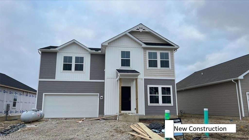 view of front of home featuring board and batten siding and a garage