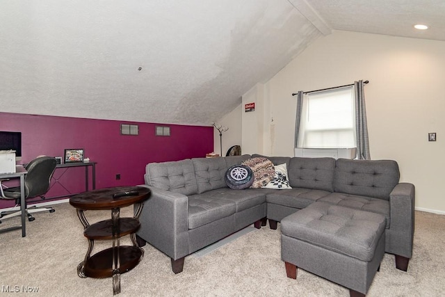 carpeted living area with vaulted ceiling with beams and baseboards