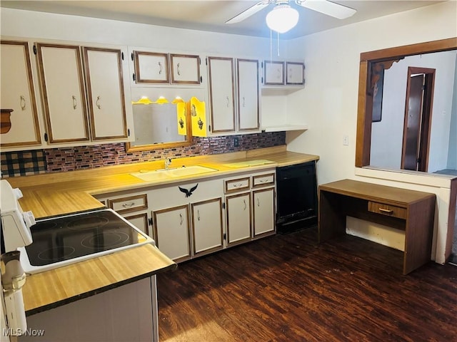 kitchen with black dishwasher, dark wood-style flooring, tasteful backsplash, a ceiling fan, and a sink