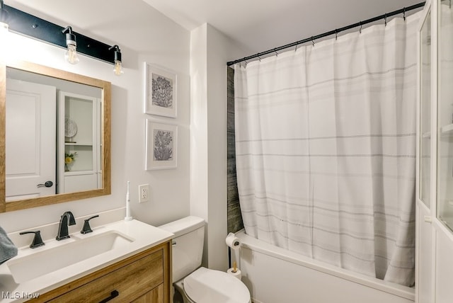 full bathroom with shower / bath combo, vanity, and toilet