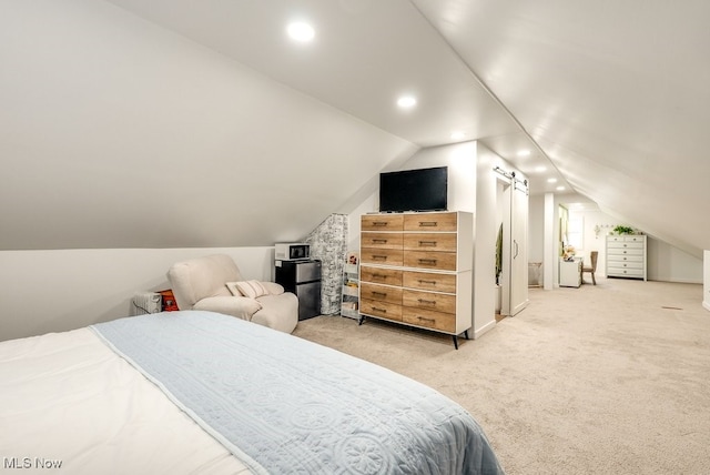 bedroom with lofted ceiling, recessed lighting, and light colored carpet