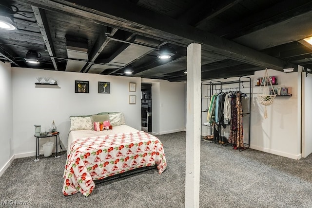 bedroom with carpet floors and baseboards