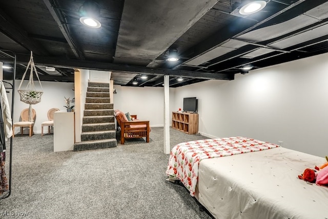 bedroom featuring carpet and baseboards