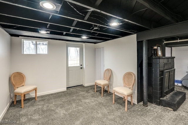 sitting room featuring carpet floors and baseboards