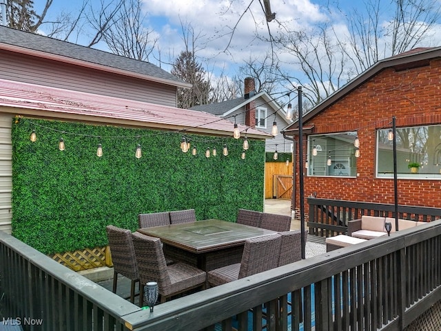 deck featuring fence and outdoor dining area