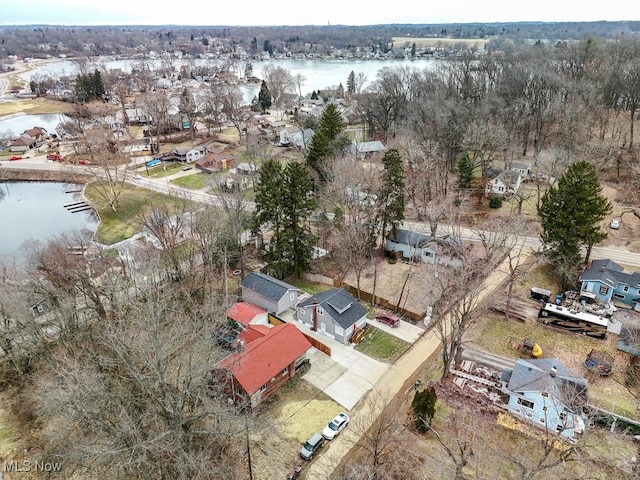 drone / aerial view with a water view and a residential view