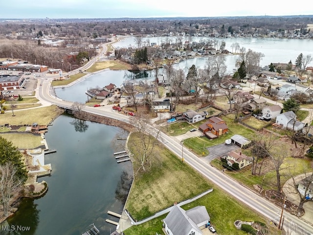 birds eye view of property with a water view and a residential view