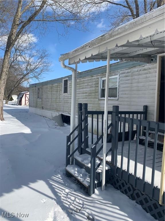 view of snow covered deck