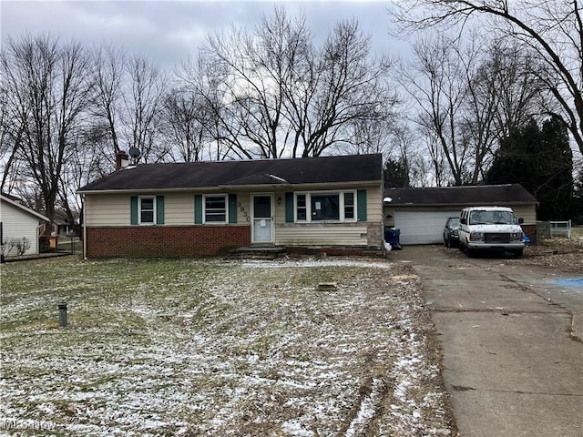 view of front of property with a garage, brick siding, and a chimney