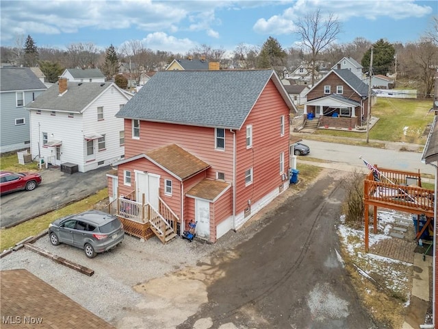 birds eye view of property with a residential view