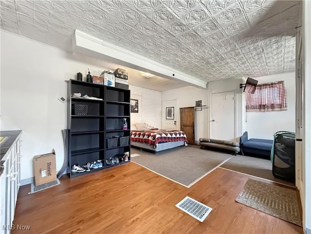 328 Scott Ave, Niles, OH 44446 - bedroom featuring wood finished floors, an ornate ceiling, and baseboards
