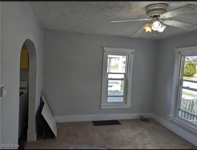 328 Scott Ave, Niles, OH 44446 - carpeted spare room with arched walkways, ceiling fan, baseboards, and a textured ceiling