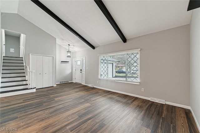 unfurnished living room featuring lofted ceiling with beams, stairway, wood finished floors, and visible vents