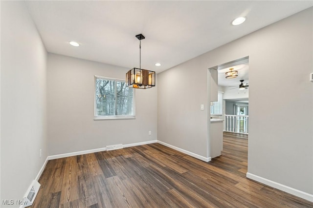 unfurnished room with visible vents, baseboards, dark wood-style flooring, and recessed lighting