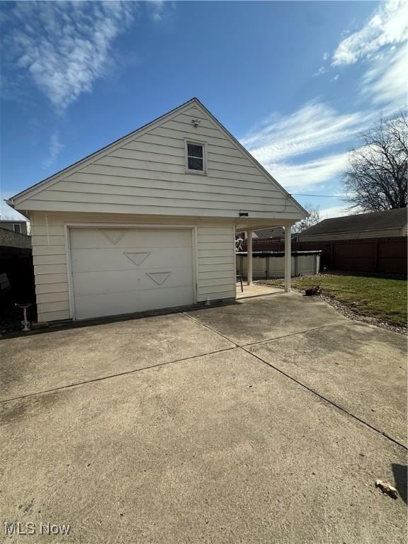 garage featuring driveway