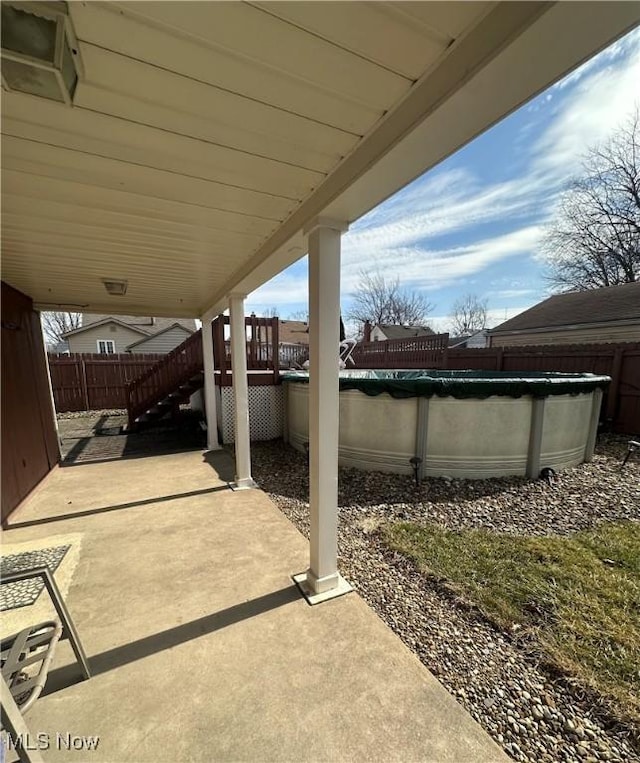 view of patio / terrace featuring fence and a fenced in pool