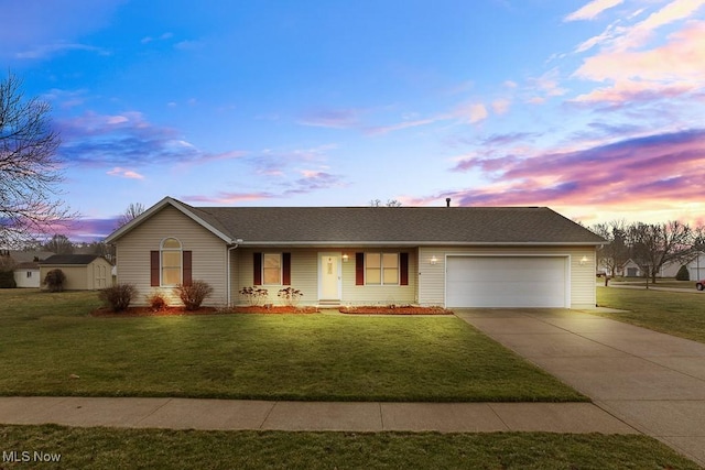 single story home with a front yard, driveway, and an attached garage