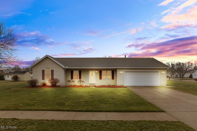 single story home with a front yard, driveway, and an attached garage