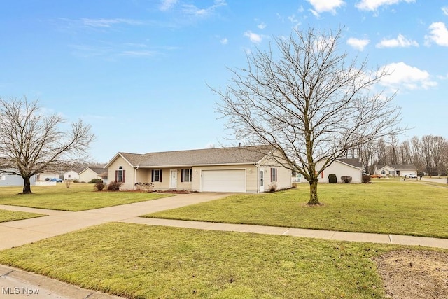 ranch-style house featuring driveway, an attached garage, and a front yard