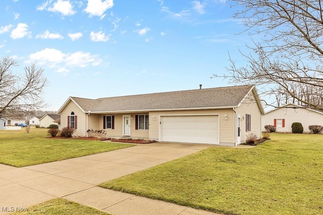 single story home featuring a garage, driveway, and a front lawn