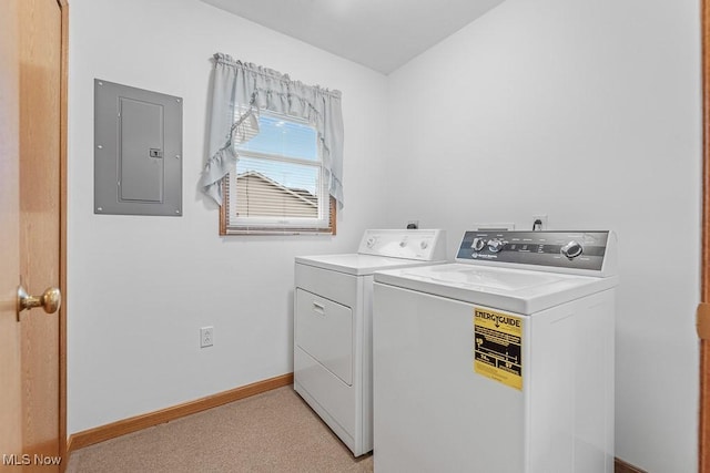 laundry room with light carpet, laundry area, baseboards, electric panel, and washing machine and clothes dryer