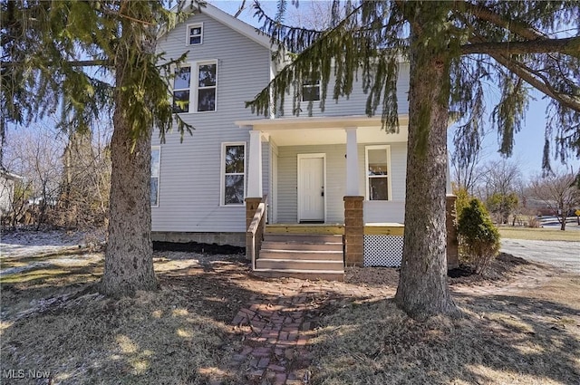 view of front of property featuring covered porch