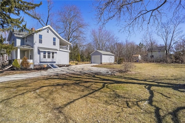 view of property exterior with a garage, a yard, dirt driveway, and an outbuilding