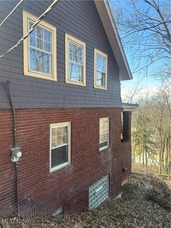 view of home's exterior featuring brick siding